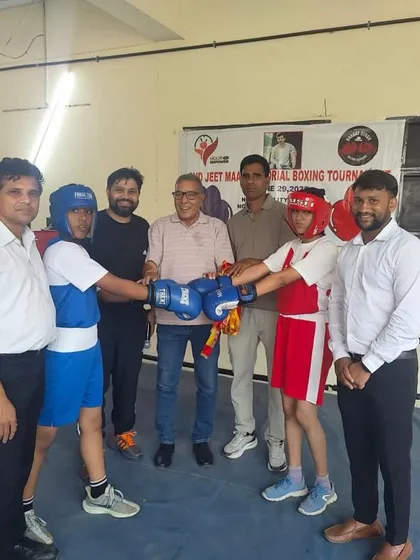 The pre-fight moment where boxers and coaches come together in the ring, showing sportsmanship before the match begins.