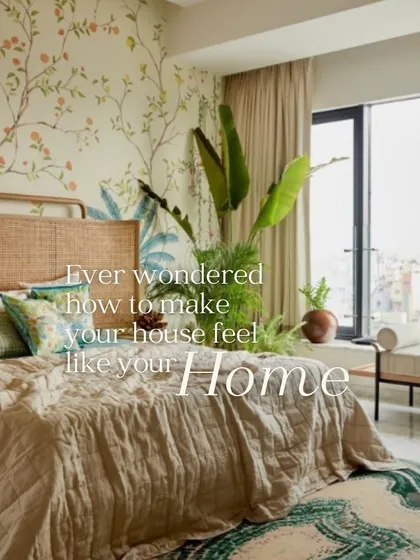 A light and airy bedroom with a botanical wallpaper featuring climbing vines and citrus fruits. It brings a fresh, organic feel to the space, making it feel like a home.