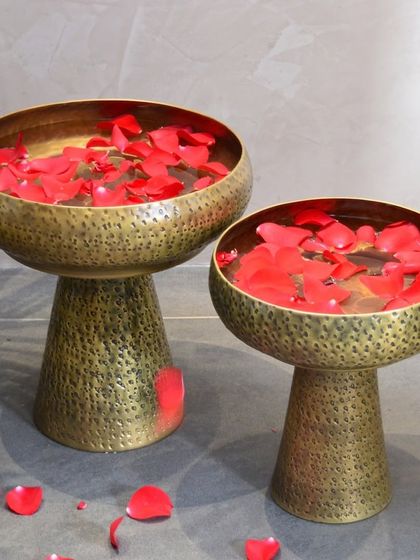 Simply fill our Sona Urlis with water and fresh flower petals to create a stunning and serene centerpiece for your home. The hammered brass finish adds a touch of rustic elegance.