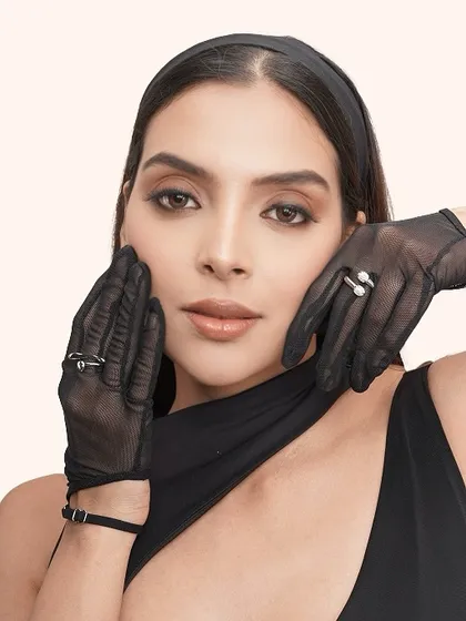 A close-up showcasing the soft, smokey eye and flawless skin, framed by elegant sheer gloves. This is beauty that meets fashion.
