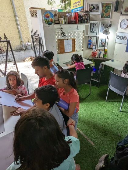 A wider view of the demonstration, showing the informal and interactive learning environment we foster in our outdoor and indoor spaces.