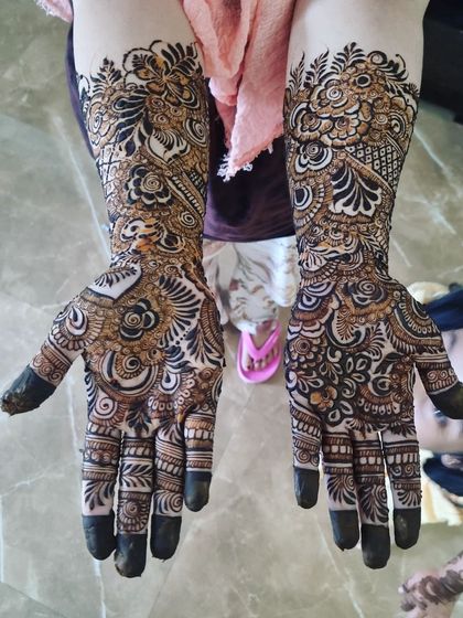 Another shot of this full-coverage henna, highlighting the rich detail and expert application. It's a perfect design for a major celebration.