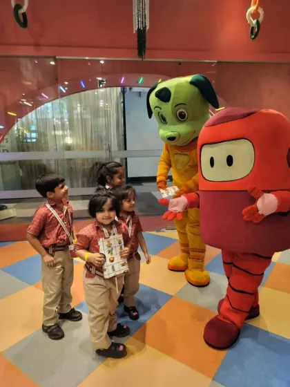 A small group of students from Somerville International School get a special meet-and-greet with our friendly mascots.