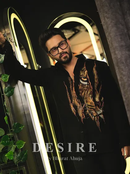A full-length shot of the tiger-print shirt, a piece that is guaranteed to command attention.