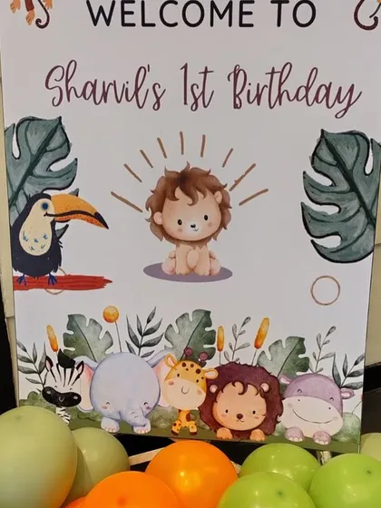 A custom welcome sign for Shanil's first birthday, featuring cute cartoon jungle animals. This sign is part of a complete themed decor package that ensures every detail of the party is cohesive and charming.