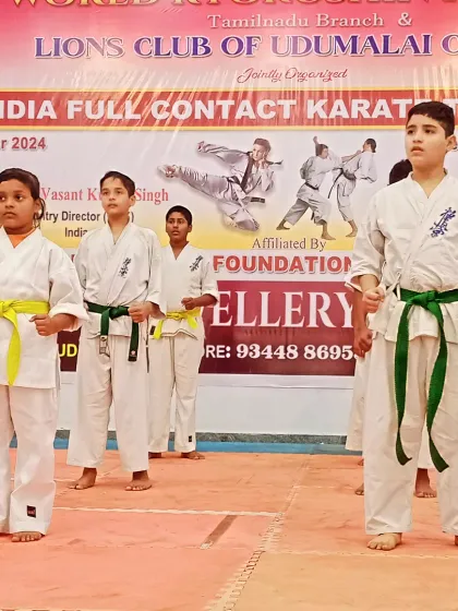 The competition is about to begin. Students are lined up on the mat, focused and ready to perform their kata.