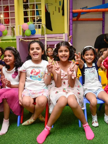 A group of happy girls posing and smiling during a break from the party games.