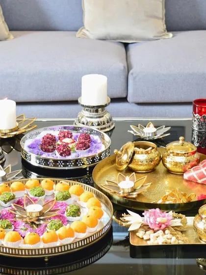 A festive tablescape ready for Lohri celebrations. It features a variety of my serving trays and bowls, showcasing how you can mix and match gold and silver pieces for a rich, layered look.
