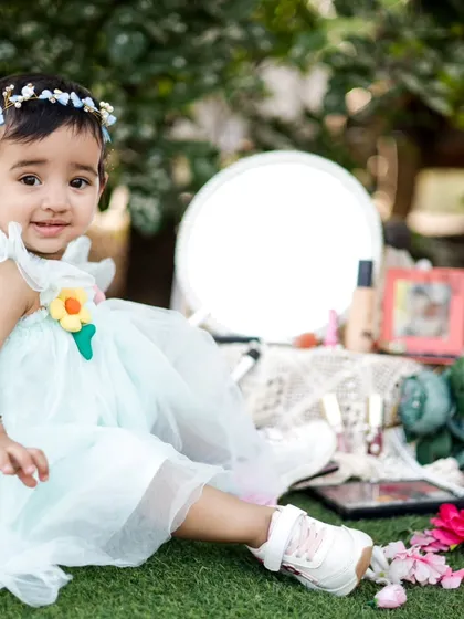 A sweet portrait from the makeup-themed birthday shoot. She looks so happy sitting among the flowers and props.