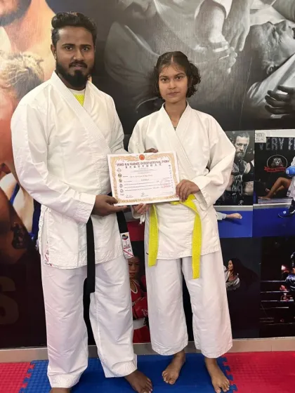 With one of our students after she received her certificate. Mentoring and guiding our fighters on their journey is our primary role.