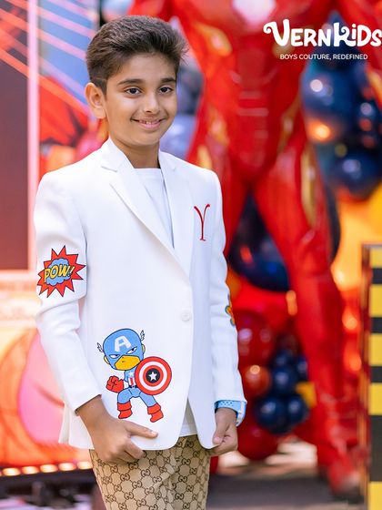 A closer look at the custom details on this superhero jacket, including the 'POW' comic art and Captain America emblem, all handcrafted for his birthday.