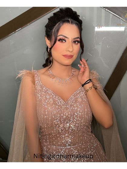 A closer look at the stunning doll-like makeup for her engagement. The focus was on creating a bright, youthful glow with perfectly blended eyeshadow and a defined lip.