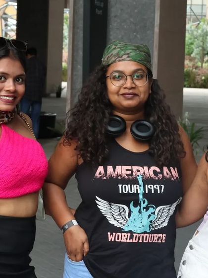 A trio dressed up in classic 90s and 2000s rock and pop outfits. The themes are a great way to get creative.