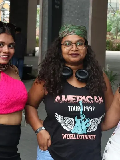 A trio dressed up in classic 90s and 2000s rock and pop outfits. The themes are a great way to get creative.