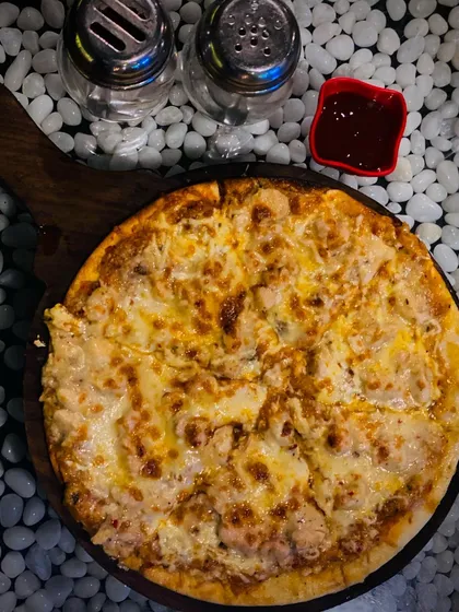 My Alfredo Pizza is pure cheesy goodness on a thin crust. It arrives at your table hot and bubbling, but it never lasts long once everyone grabs a slice.