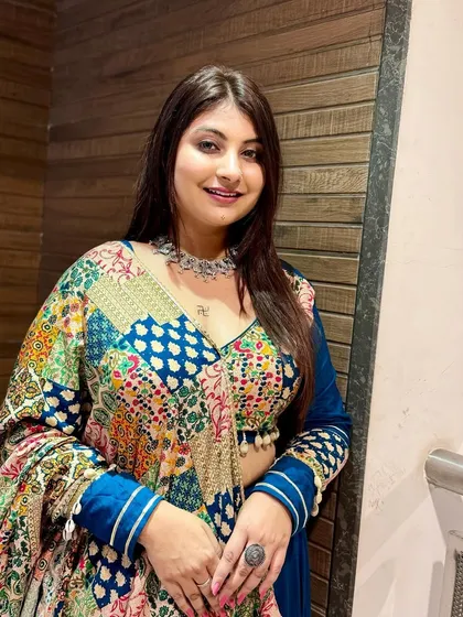 A simple and elegant makeup look for Navratri, focusing on flawless skin and a soft smile.