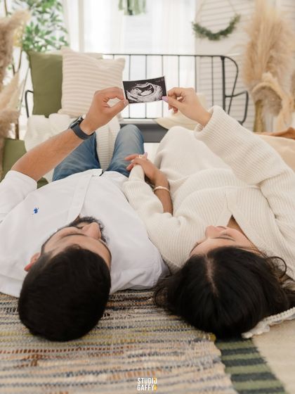 A beautiful beginning. This couple shares a quiet moment, looking at their baby's first sonogram picture, a tangible reminder of the love story that's just starting.