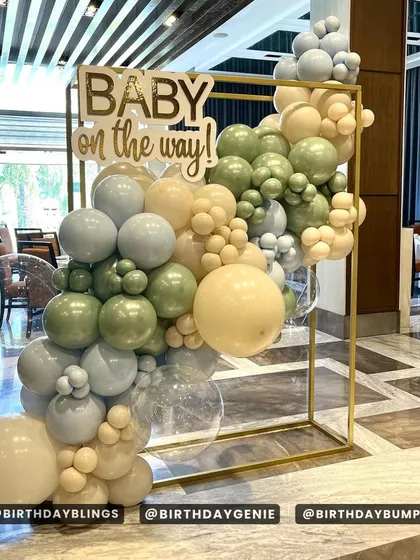 Another angle of the elegant baby shower setup, showing the full balloon structure.