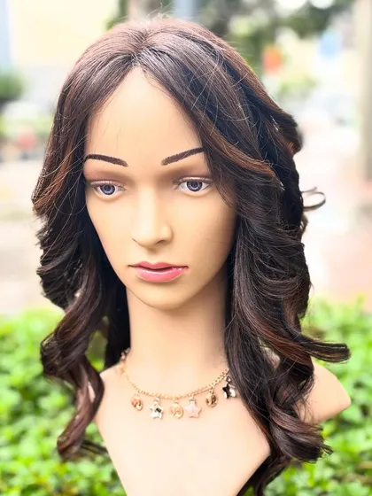 This molten honey colored wig is one of our most glamorous custom pieces. It's perfect for everyday wear and is made with high-quality Remy hair.