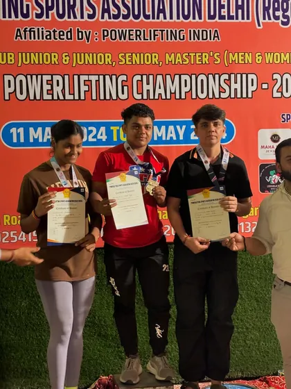 My student Sonia Dhaka on the podium after winning a silver medal at the Delhi State Powerlifting Championship.