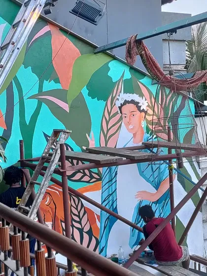 Slow and steady progress on the Frida Kahlo mural. This shot captures the layering process, with some areas fully colored while others are still being sketched out, showing how these complex images are built up over time.