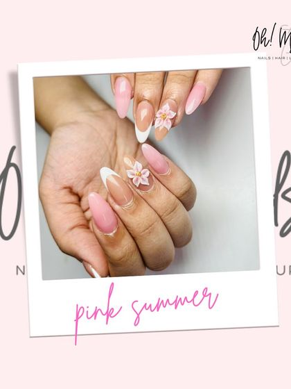 Let your nails do the blooming this season. This pink summer design features a mix of solid pink nails and French tips, accented with delicate 3D flowers.