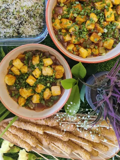 Here is a look at a complete Asian meal we catered. It features our popular crispy baby corn skewers, savoury tofu in black bean sauce, and a side of ginger capsicum fried rice, perfect for a family dinner or small party.