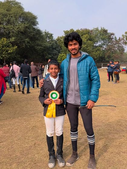 Our trainer Barath Venna with Mohak after his bronze medal win at JNEC 2024. The partnership between trainer and rider is crucial for success.