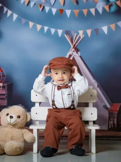 Dressed to impress for his first birthday. This little man looks dapper in his suspenders and bow tie, ready for his cake smash.