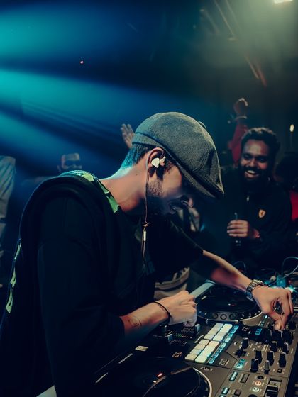 A candid moment from an Open Decks gig. You can see the joy on my face and the crowd's as we connect through the music.