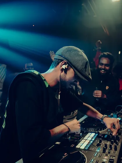 A candid moment from an Open Decks gig. You can see the joy on my face and the crowd's as we connect through the music.