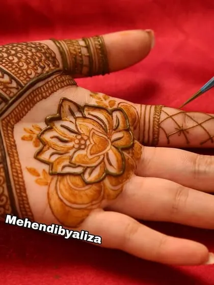A close-up of a lotus flower being drawn, a favorite motif in my designs.
