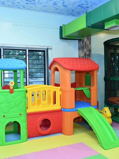 A look at the colorful playhouse structure at our Banashankari location, perfect for imaginative play and making new friends.