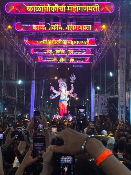 The scale of my productions is designed to handle the largest crowds in Maharashtra. This view of the Kalachowkicha Mahaganpati procession shows how my multi-layered truss and LED banner setup creates a stunning visual frame for the idol, visible to everyone.