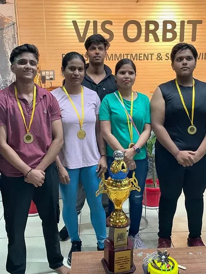 Our female champions posing with their medals and the team trophy. I am incredibly proud to coach and train alongside these strong women.