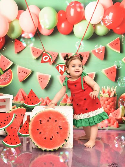 Standing tall for her first birthday! This watermelon-themed shoot captures her playful spirit and the excitement of turning one.