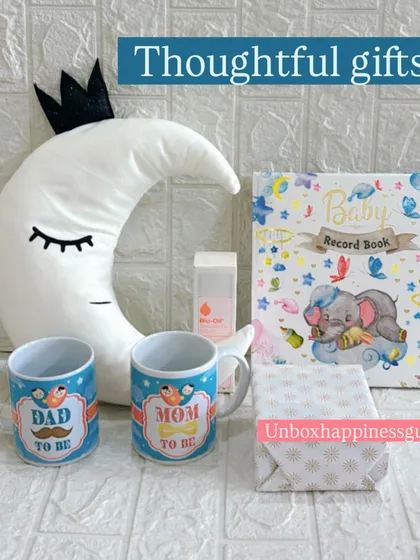 A simple and elegant display of the thoughtful gifts included in my pregnancy hampers, from practical mugs to a sentimental baby record book.