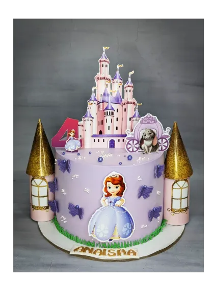 A grand Sofia the First castle cake for a 4th birthday. This fresh pineapple cake features a large castle topper and golden turrets, creating a fairytale scene.