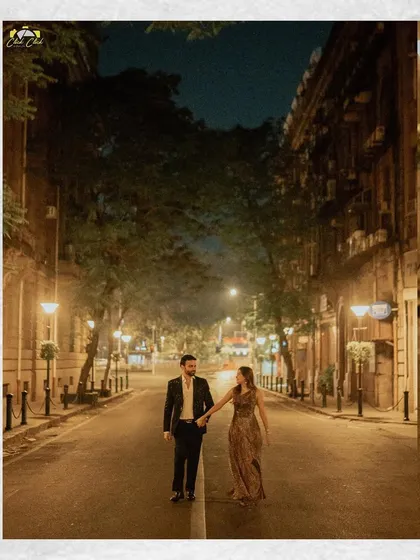 A romantic walk down a quiet, lamp-lit street in Mumbai. This shot captures the magic of the city at night.