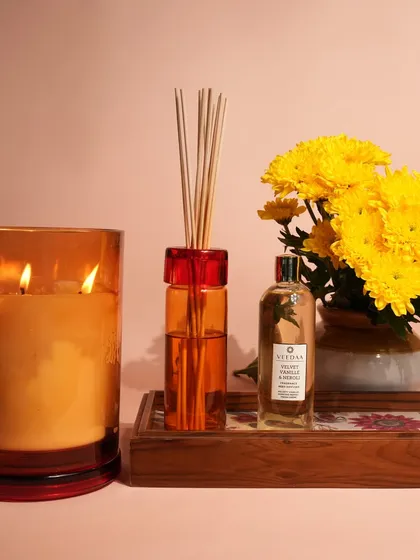 The warm glow of our three-wick coconut wax candle paired with the subtle, continuous scent of a reed diffuser. This is how I create a complete sensory experience, layering fragrances to build a truly inviting atmosphere in any room.