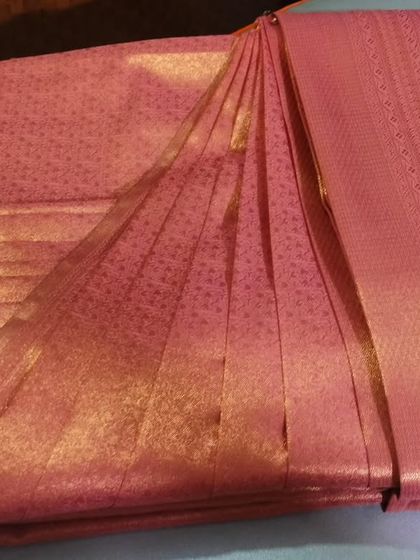 A finished, box-folded saree ready for delivery. This method is ideal for clients outside Mumbai or for anyone who needs to travel with their sarees for a destination wedding or event.