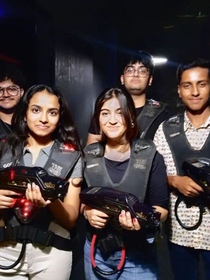 A duplicate of image 68, showing another group of friends ready for laser tag.