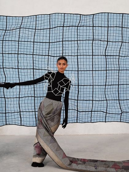 For the Shanti Banaras 'The Line' campaign, we created a wearable sculpture. The model is styled in a draped Banarasi textile and a geometric cage-like accessory.