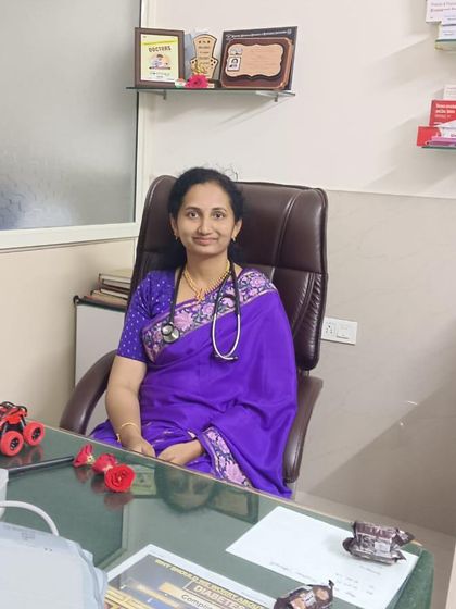 A doctor and a dear client, looking so elegant in her purple saree even at her workplace. It shows how versatile a saree can be.
