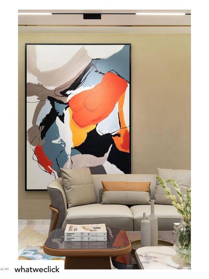 The 'Colour Cluster' canvas installed in a client's home. It acts as a powerful statement piece, anchoring the living room with its vibrant energy and modern aesthetic.