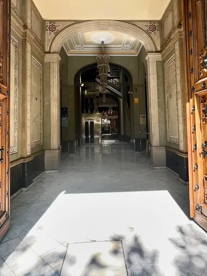A grand entrance with massive, intricately carved wooden doors in Spain. Doorways are powerful architectural statements, and the sense of history and craftsmanship in this entrance is a constant reminder to make every entry feel significant.