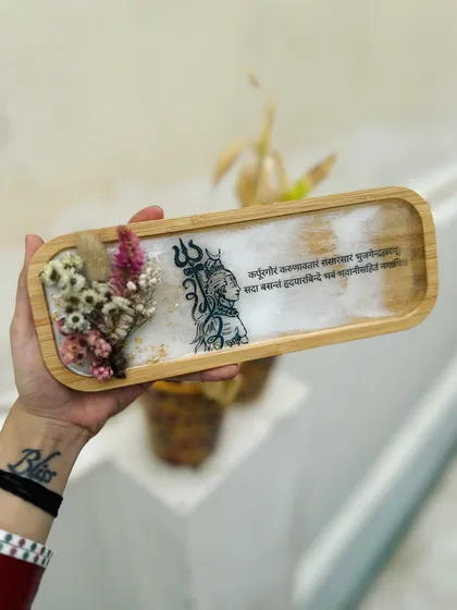 Om Namah Shivay. This wooden tray with a Shivji design and mantra is for those who share my vibe. It's decorated with dried flowers for a natural touch.