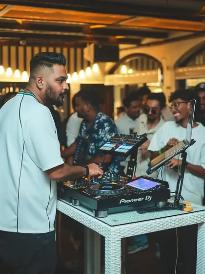 Focused on the decks at a private party. Even in a more relaxed setting, the music is always the priority.