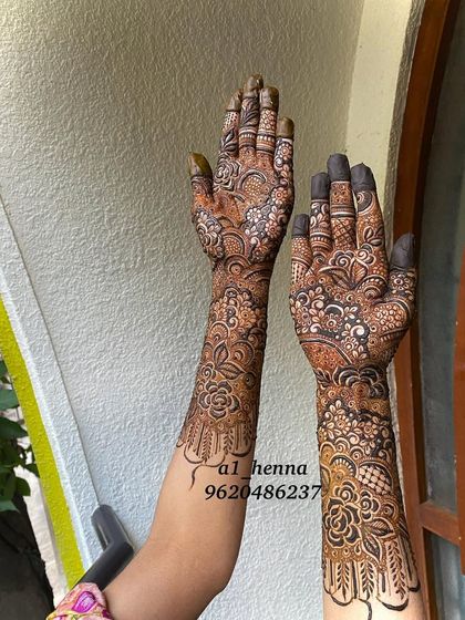Another angle of this intricate bridal design, showing how the pattern flows from the palm up the arm.