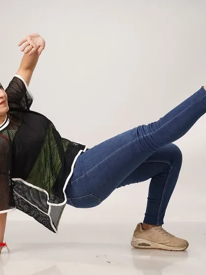 A more grounded, powerful pose from the same photoshoot. My dance style ranges from graceful and fluid to strong and impactful.
